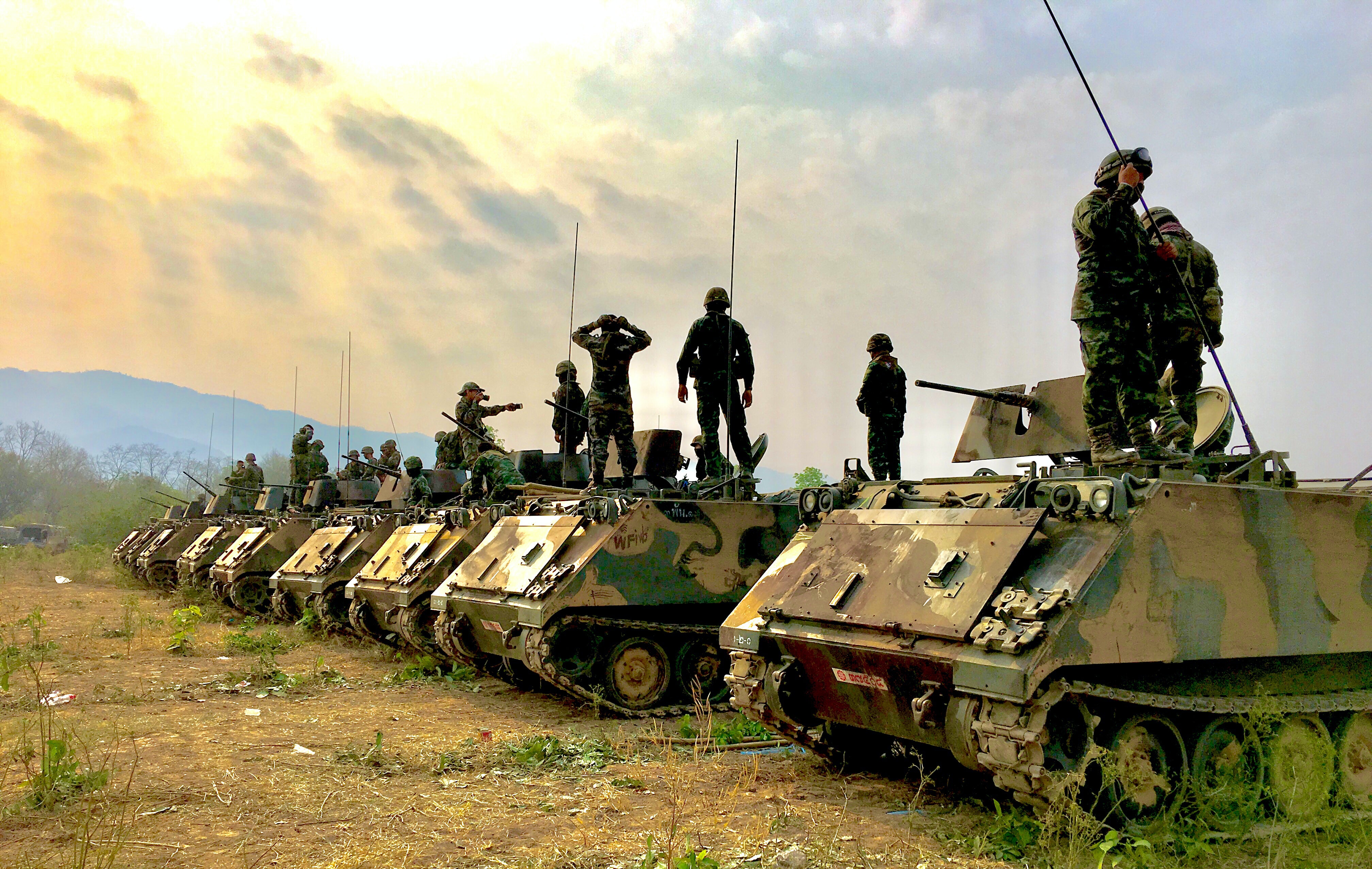 Soldiers on top of Tanks